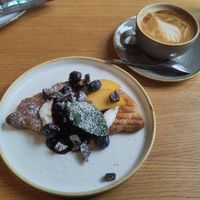 Loaded croissant and oat flat white at DUUO in Munich