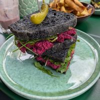 Beetroot, caper and mandarin sandwich with activated charcoal bread at Manga Rosa in Lisbon