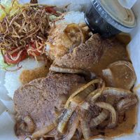 Vegan hamburger steak plate  with a side of wedge saladd  at Onolicious Hawaii in Cincinnati