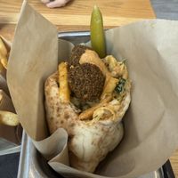 Falafel sandwich with fries inside, harissa tahini saucee  at Goldie - Midtown in Philadelphia