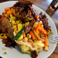 Bakad potatis med seitan och hummus. at Kartoffelkogge in Rostock