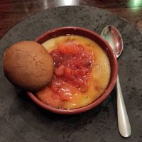 Coconut rice kheer from the vegan dessert menu - jasmine rice pudding with Demerara glaze, plum compote and ginger biscuit at Cookfella's in Guisborough