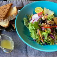 Basic salad platter and sourdough toast with strawberry jam, citrus and black sesame dressings  at  Ikuri in Kyoto