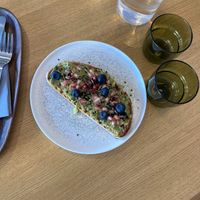 Toast with edible flowers, very tasty at MUTO in Madrid