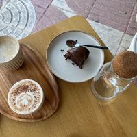 Vegan cappuccino and latte, and banana bread (missing a bite) at MUTO in Madrid