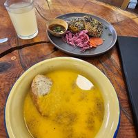 Carrot and ginger soup, lemon and ginger juice, rice paper empanadas with a peanut sauce and pickled veggies at Café Vida in La Paz