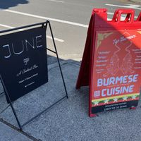 Their signpost and one other for a nearby restaurant  at JUNE in Beaverton