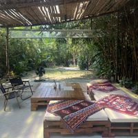 Outdoor seating leading onto the river   at PlantLab in Hoi An