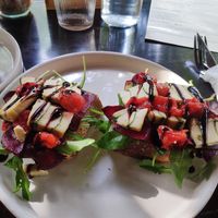 Fermented cheese with beetroot, tomatoes and greens. I would like to have maybe a garlic spread on the bread or some kind of spread as the bread is plain. at PlantLab in Hoi An