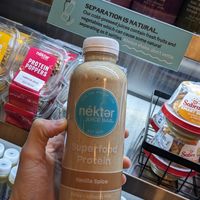 Posted sign on the case to shake your juices kind of cute, always shake don't settle at Nekter Juice Bar in Reno