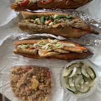 Three different hoagies, chickpea salad with grilled cauliflower, and garlic pickles   at Black Market Meats in Lakewood