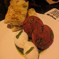 Focaccia with tomatoes and cashew mozzarella at Aliado Bar & Aperitivo in San Juan