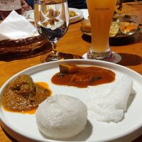 Sanna (a sweet rice bread), neer dosa, with a spicy stuffed brinjal curry and a raw mango curry. Flavour heaven at Oota in Bangalore