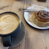 Oat latte & cinnamon bunn  at The Paddle in the Forest in Brockenhurst