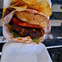 Burger with chips and carrot sauce at GuanaVeg in Guanajuato