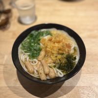 Tempura batter and tofu topped udon noodles and broth   at Breakfast Udon - 朝うどん in Kyoto