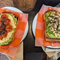 Dos tostones de palta con cubiertas distintas at La Manteca Negra in Buenos Aires
