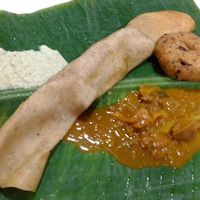 Good curry & coconut sauce w/ a dhosa & donut-like pastry. at Malayan Cafe in Jaffna