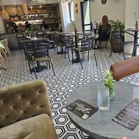 Couch lounge and table seating at HAAM - Caribbean Plant Cuisine in Brooklyn