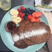 buckwheat pancakes with banana, berrys and maple syrup at Bataat in Amsterdam