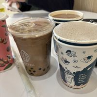 Oolong milk tea with boba, black sesame hot milk tea. Drinks in the back were a hazelnut mocha and I’m not sure what the other was.   at Nuttea in Toronto
