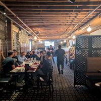 Inside of the restaurant looking back toward the door from the bar area  at Spice & Tonic - Indian Cuisine & Bar in Minneapolis