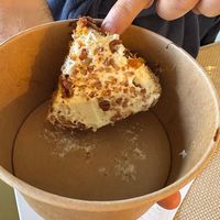 Takeaway “service”: dessert packed upside down, icing ruined, then charged extra.  at Casa Vegetariana in Porto