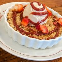 Apple crumble with ice cream. This was so excellent we bought another one. at Teva Deli in Rio De Janeiro