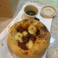 The extra pesto in oil is too die for with the focaccia   at Teva Deli in Rio De Janeiro