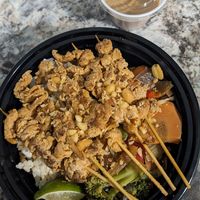 Soy curl satay skewers with stir fried veggies, Jasmine rice, and peanut sauce at Cornflower Cafe in Appleton