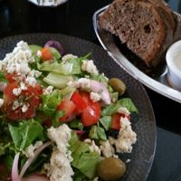 Vegan Greek salad with vegan nut feta cheese and pickled onions at Meshek Barzilay in Tel Aviv