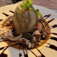 Eggplant and pepper with vegan cheese, garlic and cream cheese (huge piece of bread on the side)  at Meshek Barzilay in Tel Aviv
