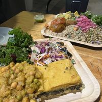 Buffet with a lot of options and gluten free options too, "meatballs", quinoa, salads, vegetable curry, something similar to lasagna, tofu, tempeh  at Meshek Barzilay in Tel Aviv