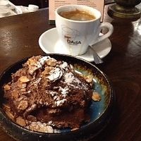 Chocolate mousse with crispy almond flakes 💥 at Meshek Barzilay in Tel Aviv