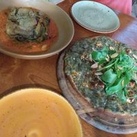 Lasagna and pizza with spinach at Meshek Barzilay in Tel Aviv