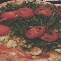 Pizza with vegan cheese at Pizzeria Foculus in Ljubljana