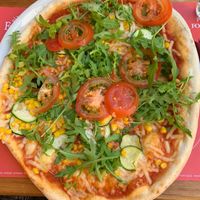 Summer pizza with vegan cheese and sweet corn at Pizzeria Foculus in Ljubljana