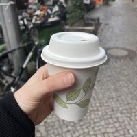 Tiny cup of ‚matcha‘ latte   at Pele-Mele in Berlin