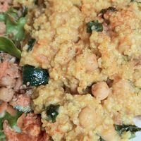 Millet with dates and salad - close-up at Pele-Mele in Berlin