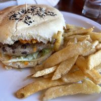 Lenteja burger with vegan toppings plus friesd  at Rústica in Puerto Madryn