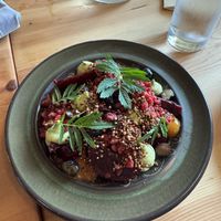 berries, beets & basil (red roasted beets, apricot jam, basil cheese, blueberries, raspberries, koji quinoa crumble marigold)  at Feral in Portland