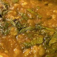 Yellow lentil cooked with turmeric, cumin & lots of garlic. - Manjal dal tadka  at Zamorins in Whitley Bay