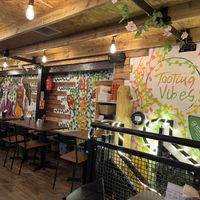 Upstairs seating above kitchen in covered market   at Green Choy - Tooting in South West London