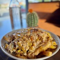 Queso-Loaded Fries with Drunken Beans   at PlanTita's Kitchen in Long Beach