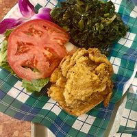 Crispy chicken sandwich. Juicy mushroom fried to perfection and delicious sauce and collard greens at Jen's Organics in Springfield