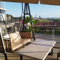 Outside seating options at Kala Poke in Encarnacion