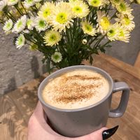 Vegan latte with coconut milk and cinnamon at Cafe Emigrant — Էմիգրանտ in Yerevan