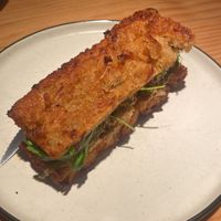 Focaccia specials dish with kimchi and spinach   at Rasoterra in Barcelona