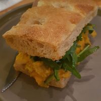 Focaccia con kimchi artesano, paté de zanahoria y rúcula at Rasoterra in Barcelona