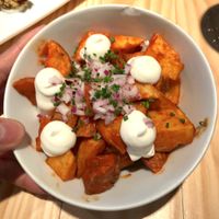 Bravas potatoes with hot tomato sauce, vegan allioli, red onion and chive.
This was very tasty and super filling haha. A staple Catalonian tapa that they veganized. Would recommend to share. at Rasoterra in Barcelona